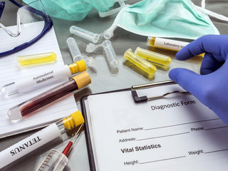 Doctor working with samples of contagious diseases in a clinical laboratory