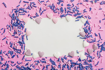 sugar sprinkles on pink background