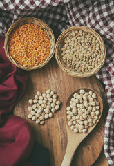 Variety Of Legumes And Grains On A Wooden Surface