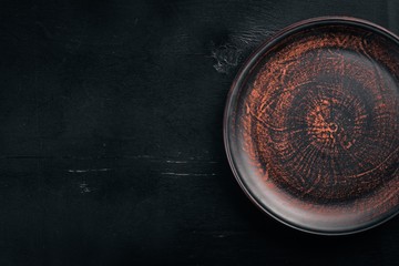Clay dishes. Plate. Top view. Free space for your text.