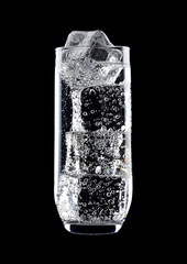 Glass of sparkling water soda drink with ice