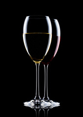 Glasses of red and white wine on black