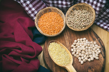 Top View Of Lentils, Chickpeas And Cracked Wheat On A Wooden Surface 