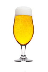 Cold glass of lager beer with foam and bubbles