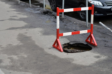 barrier around sidewalk pit