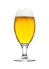 Cold glass of lager beer with foam and bubbles