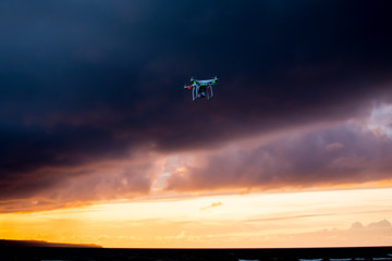 Flying drone over sea and cloud sky