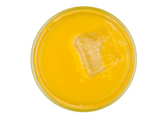 Orange soda drink with ice cube top view