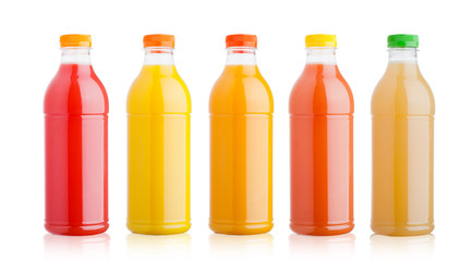 Plastic bottles with fresh organic juice on white