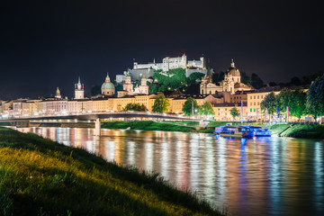 Fototapeta na wymiar Great view on an evening city shining in the lights. Picturesque scene. Location famous place (unesco heritage) Festung Hohensalzburg, Salzburger Land, Austria, Europe. Beauty world