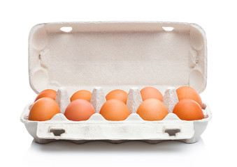 Raw farm fresh eggs in white paper tray