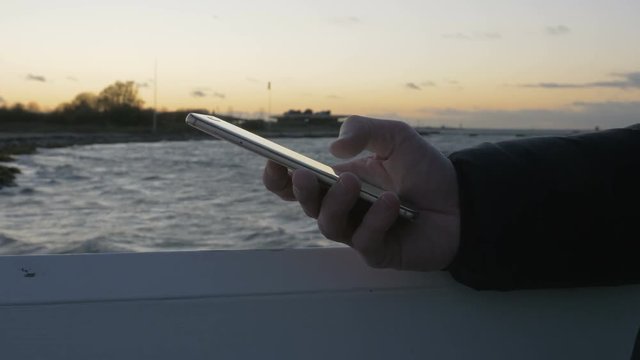 Hand typing sms mms on a smartphone