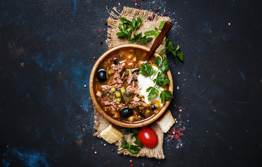 Russian Meat Solyanka Soup In Wooden Bowl, Top View