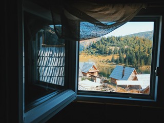 window view over lake village in mountains 
