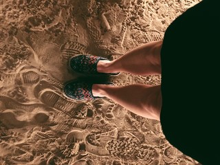 girls legs on sand desert in dubai