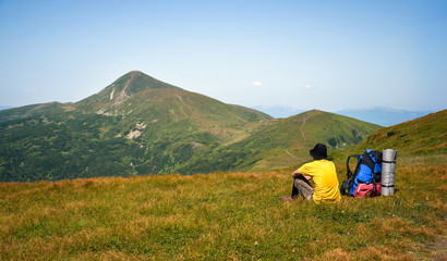 hiker is relax on mountains meadow