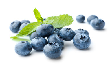 Ripe blueberries on white background