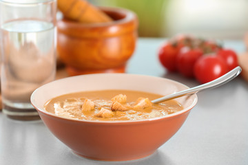 Bowl of homemade lentils creme soup on table