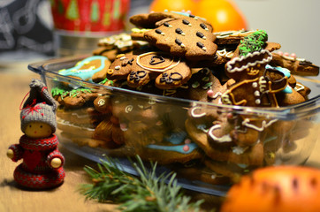 Homemade colourful christmass ginger cookies in christmas decoration on the table