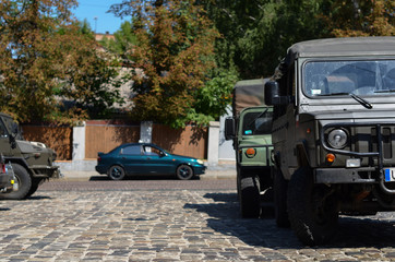 Obraz na płótnie Canvas Military SUV car parked in city