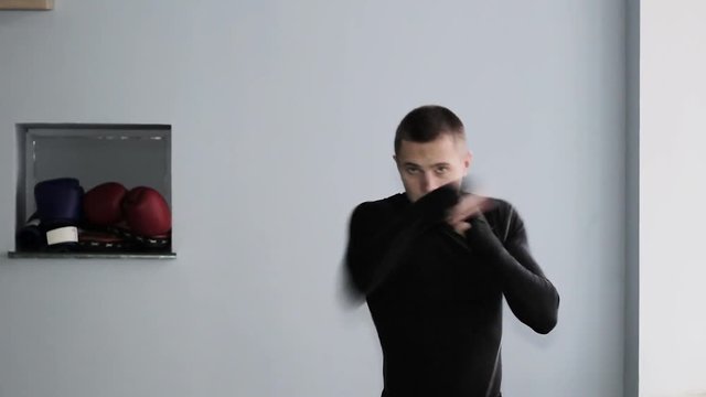 guy boxer trains in the gym