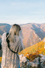 girl taking shoots on top of mountain on autumn day 