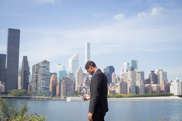 Young African American business man checks text message or tweating during break at work