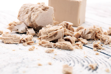 Dry yeast crumbled and yeast block for baking.