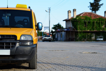 taxi minivan parked on street