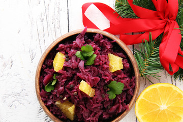 Red Cabbage salad with orange and pecan nuts for Christmas dinner. Vegetarian dish