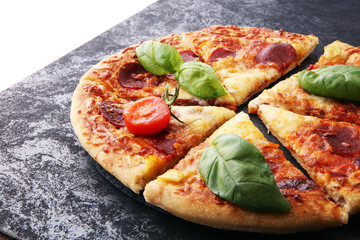 Hot Homemade Pepperoni Pizza Ready to Eat with basil.