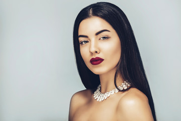 Beauty and Fashion. Glamour girl portrait, Long smooth brunette black hair,Holiday make up,red...
