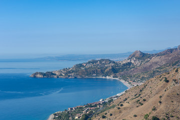 Taormina Bay in a summer day seen from Forza D'Agrò, Sicily