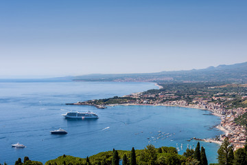 Taormina Bay in a summer day seen from  greek theater in Taormina
