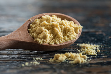 Ground Yellow Mustard Spilled from a Teaspoon