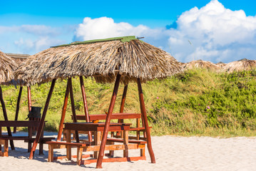 View of a gazebos on a sandy beach, Varadero, Matanzas, Cuba. Copy space for text.