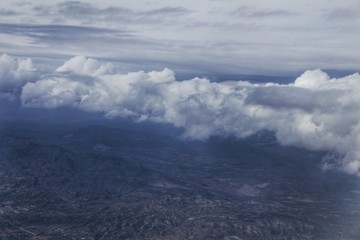 Clouds and landscape from an airplane