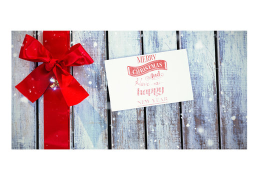 Holiday Card Mockup with Red Ribbon on Wooden Table