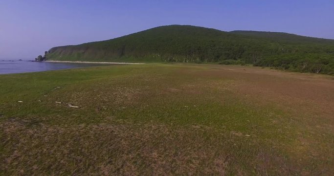 Descending aerial view of the birdman house near lake Blagodatnoye at the Sikhote-Alin Nature Reserve in Russian Far East. It has been inscribed on the UNESCO World Heritage List since 2001.