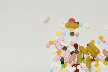 colorful pills and drugs in close up. Medicine and vitamin on white background