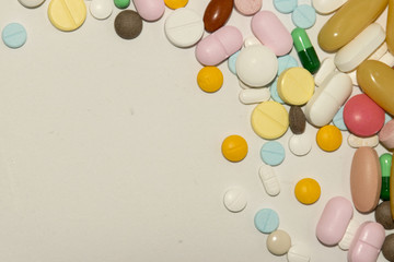 colorful pills and drugs in close up. Medicine and vitamin on white background