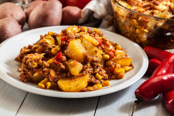 Portion of mexican potato casserole with minced meat