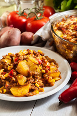 Portion of mexican potato casserole with minced meat