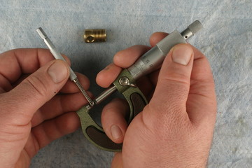 Metric Micrometer,  small hole gauge, blue shop towel background, brass part