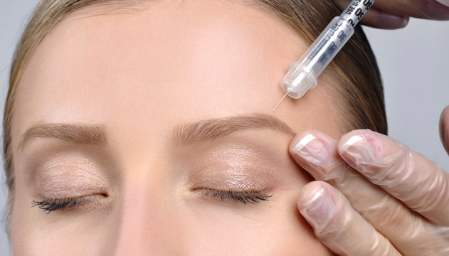 Woman is getting botox injection. Anti-aging treatment and face lift. Cosmetic Treatment and Plastic Surgery