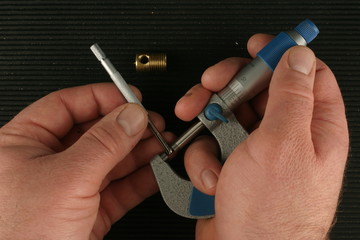 Imperial Vernier Micrometer,  Small hole gauge, black toolbox mat background, brass part