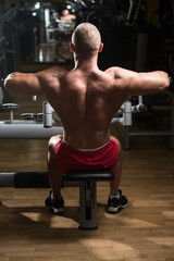 Obraz na płótnie Canvas Athlete Doing Heavy Weight Exercise For Back