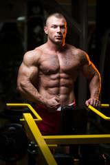 Attractive Young Man Resting In Gym Afther Exercise