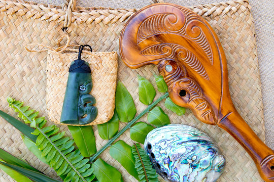 New Zealand - Maori themed objects - Jade Pounamu pendant, Paua shell, Wooden Patu