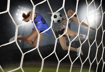 Young woman playing soccer